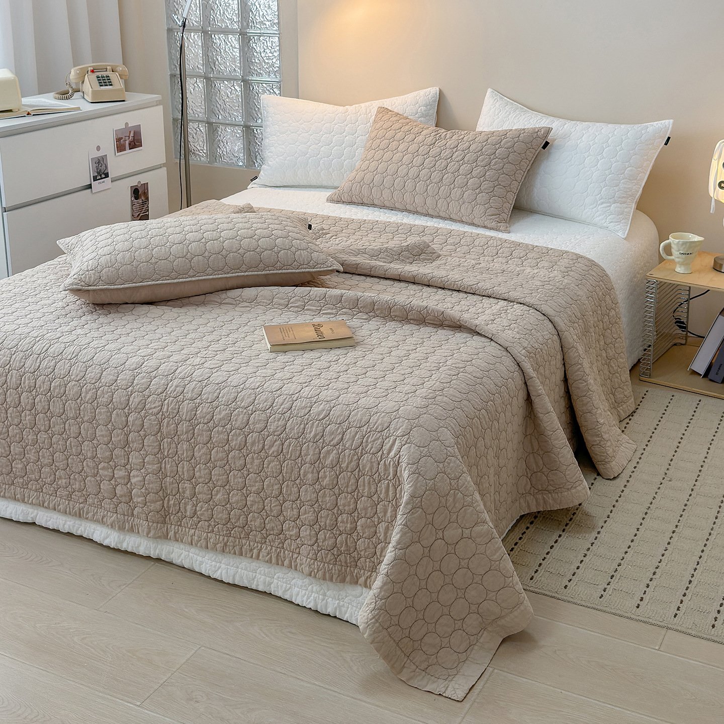 A close-up of the soft, matted texture of a stone washed quilt